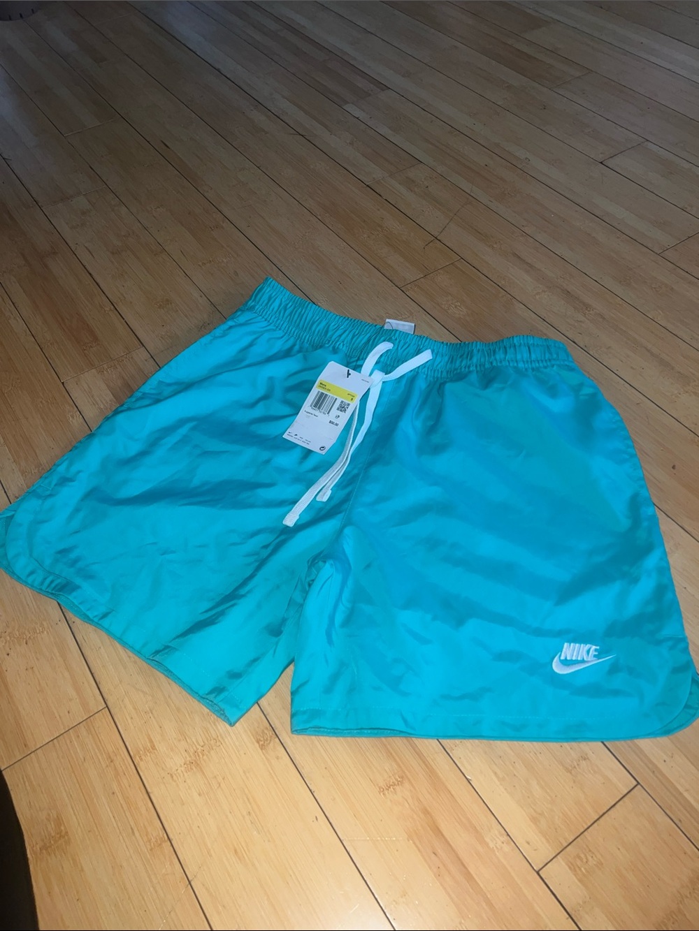Nike Turquoise Swim Shorts with White Swoosh